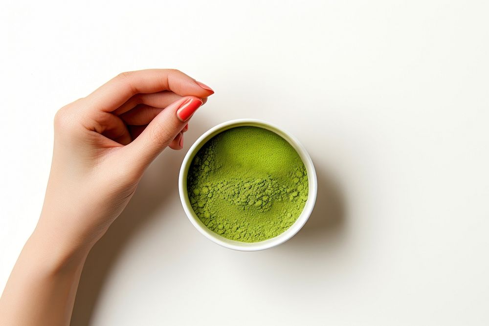 Matcha hand white background refreshment. AI generated Image by rawpixel.
