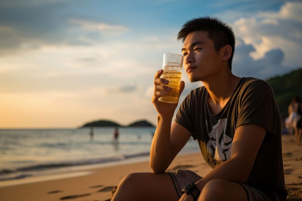 Thai teenager drinking at Bangsean Beach beach beer land. AI generated Image by rawpixel.