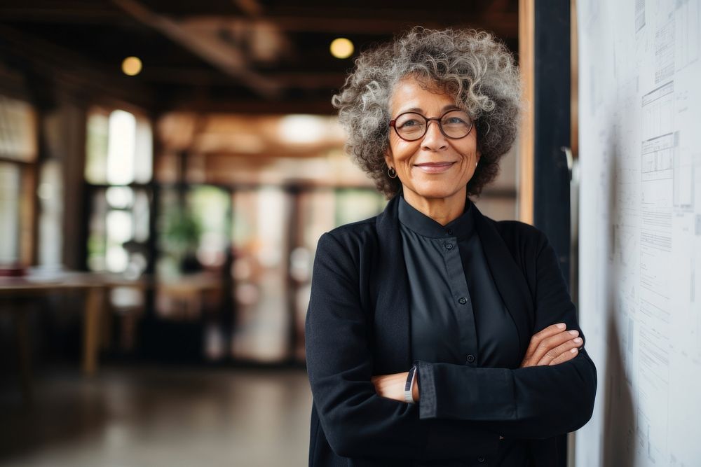 A multiracial senior woman architect glasses adult smile. AI generated Image by rawpixel.