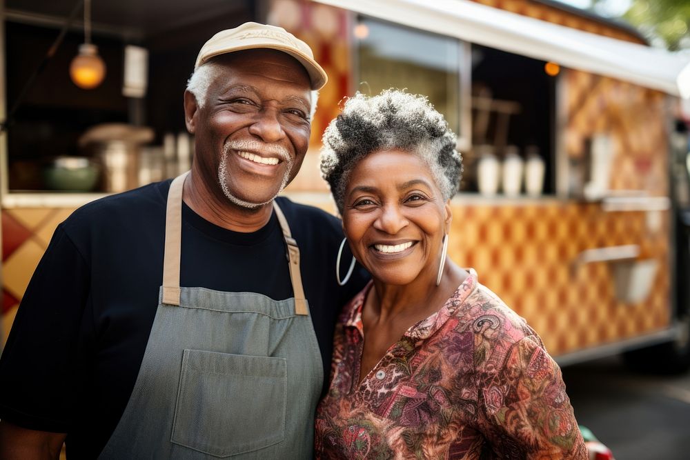 A multiracial senior couple in front of food truck portrait smiling adult. AI generated Image by rawpixel.