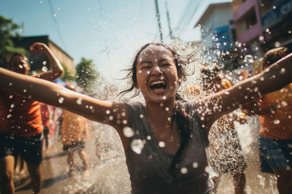 People playing water at songkran festival in thailand adult architecture celebration. AI generated Image by rawpixel.