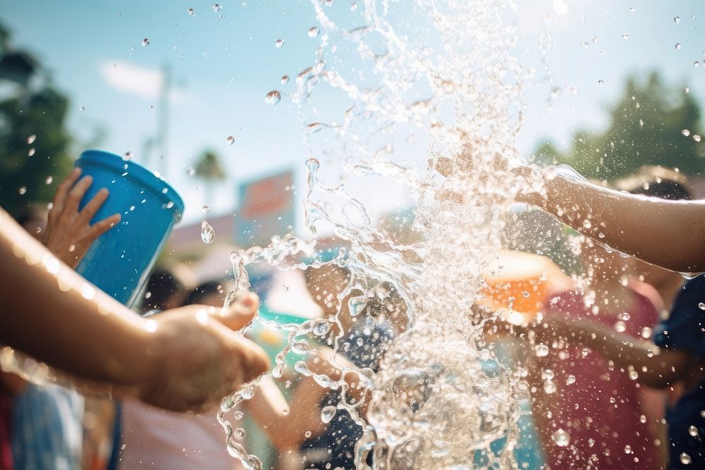 People playing water at songkran festival in thailand summer hand togetherness. AI generated Image by rawpixel.
