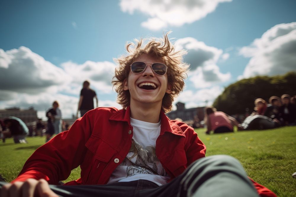 Teenager grass sunglasses laughing. AI generated Image by rawpixel.