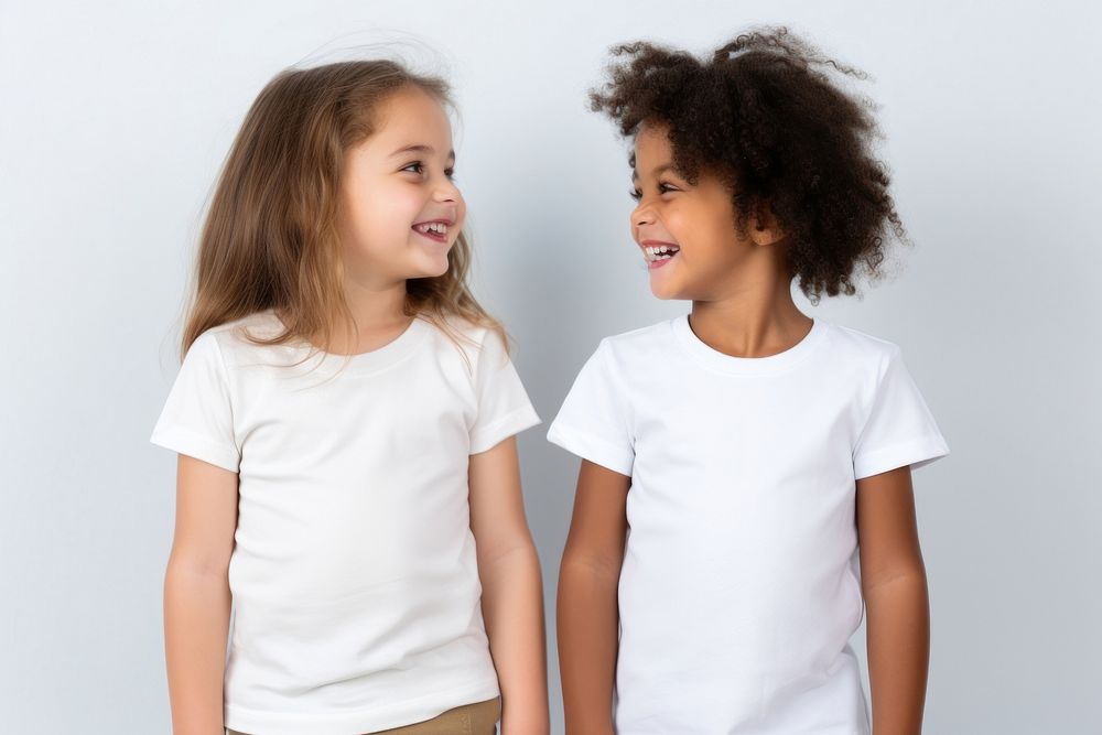 2 children wearing white t-shirt laughing fashion sleeve. AI generated Image by rawpixel.
