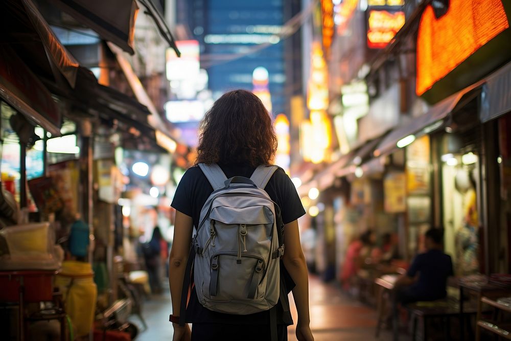 Asian backpacker in the street at bangkok walking adult city. AI generated Image by rawpixel.