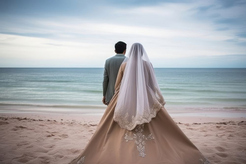 Indonesean Couple wedding at the beach celebration outdoors fashion. AI generated Image by rawpixel.