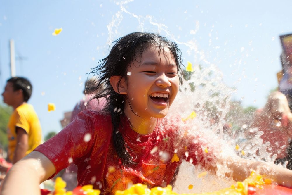 Laos teenager playing songkran festival at Vientiane portrait summer adult. AI generated Image by rawpixel.