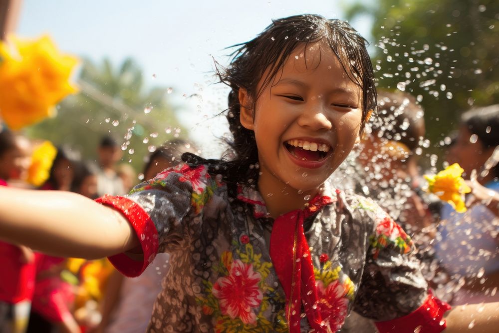 Laos teenager playing songkran festival at Vientiane portrait summer smile. AI generated Image by rawpixel.