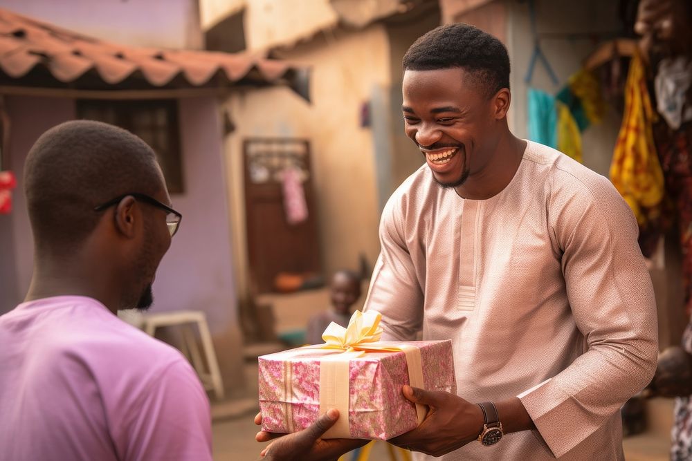 Nigerian man adult gift togetherness. AI generated Image by rawpixel.