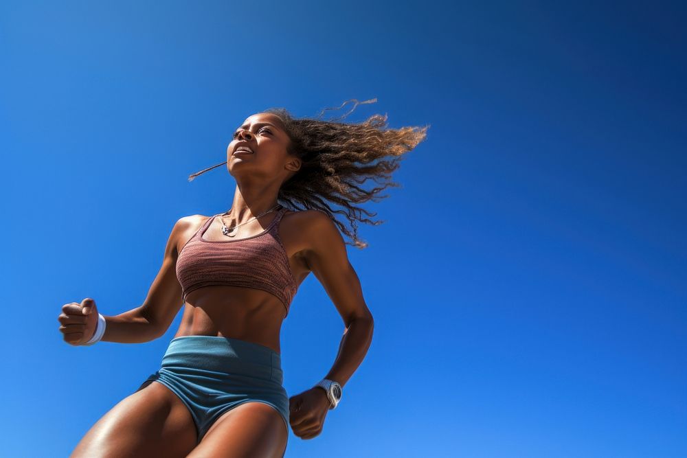 Female athlete running sunny blue. AI generated Image by rawpixel.