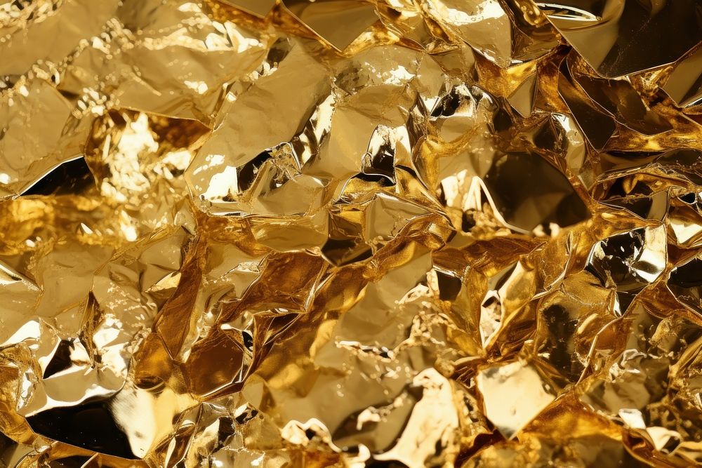Crumped foil backgrounds gold abundance. 