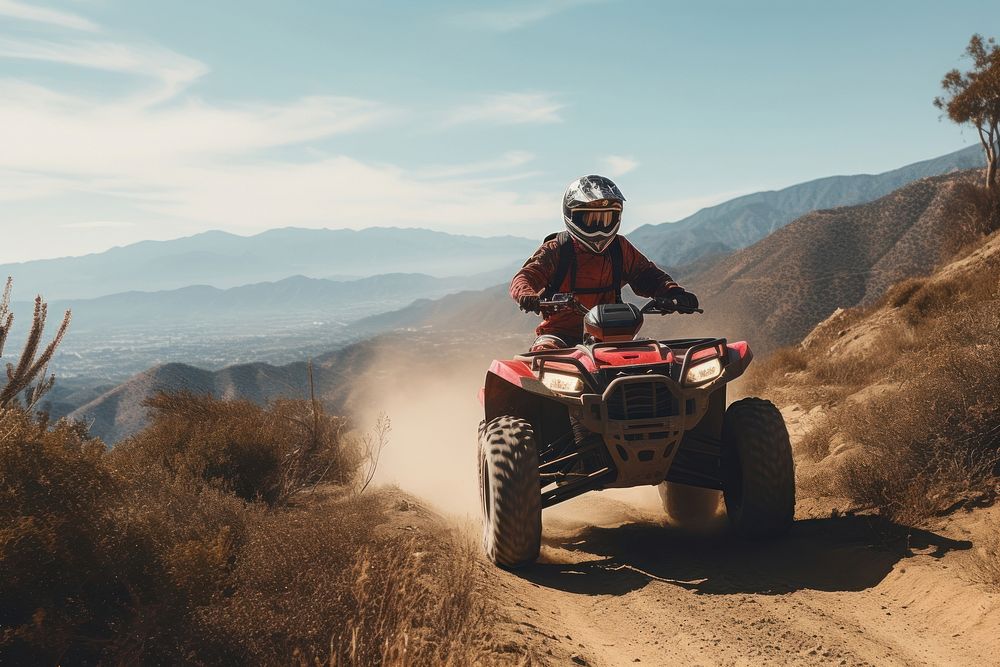 Man riding red ATV helmet adventure mountain. AI generated Image by rawpixel.