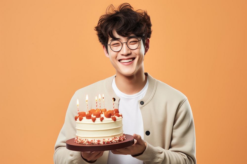 Happy Korean man birthday party cake dessert smile. AI generated Image by rawpixel.