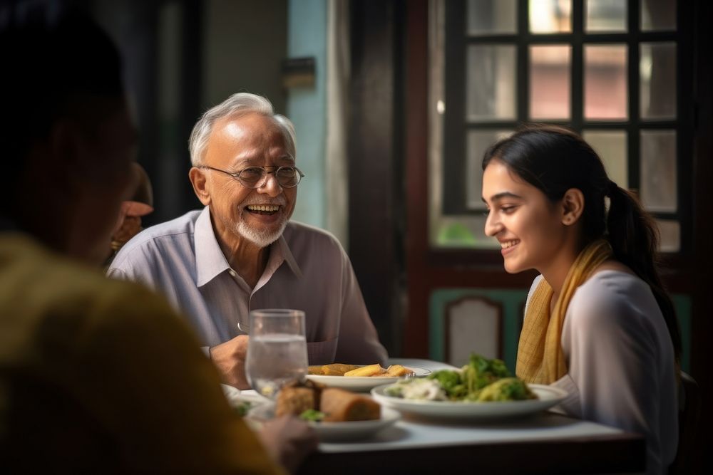 Senior man and senior women and a girl teenager south asian restaurant adult happy. AI generated Image by rawpixel.