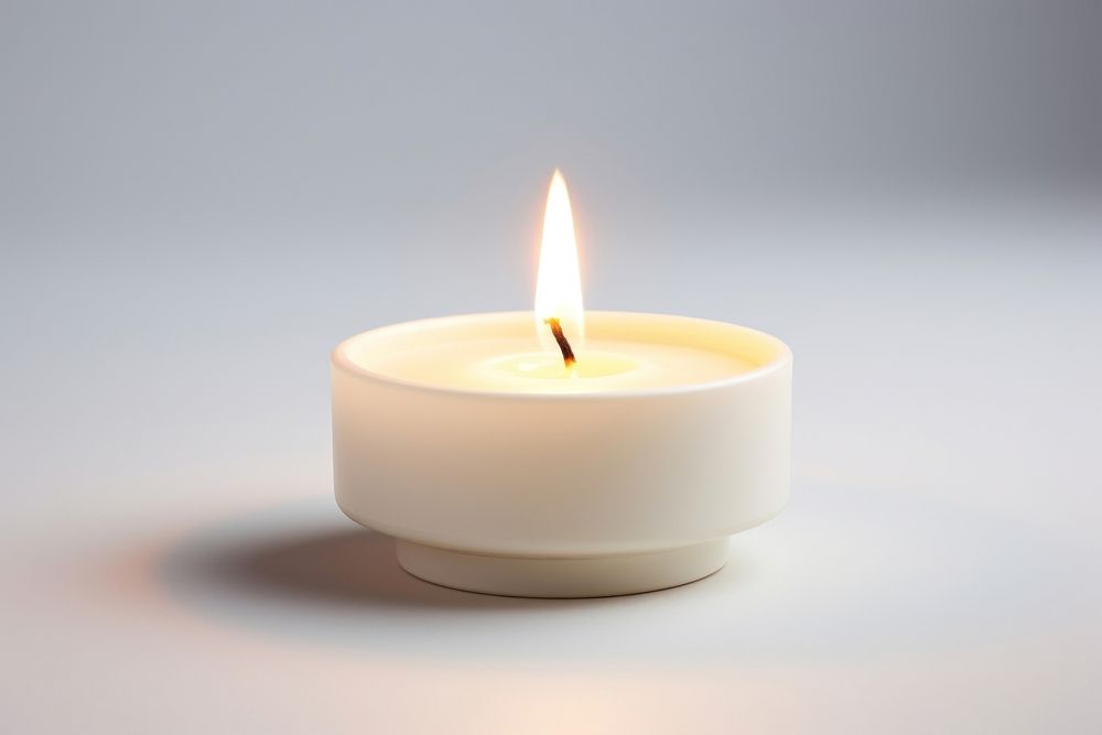 Tealight Candle candle fire illuminated. AI generated Image by rawpixel.