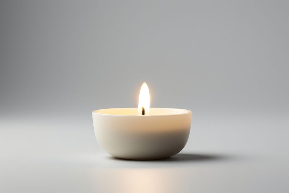 Tealight Candle candle fire illuminated. AI generated Image by rawpixel.