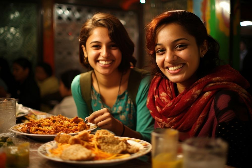 Teenager woman and a girl south asian food restaurant portrait. AI generated Image by rawpixel.