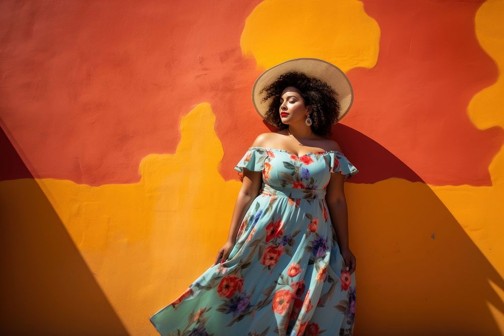 Chubby Latina woman in a sundress standing in front of a colorful wall fashion adult architecture. AI generated Image by…