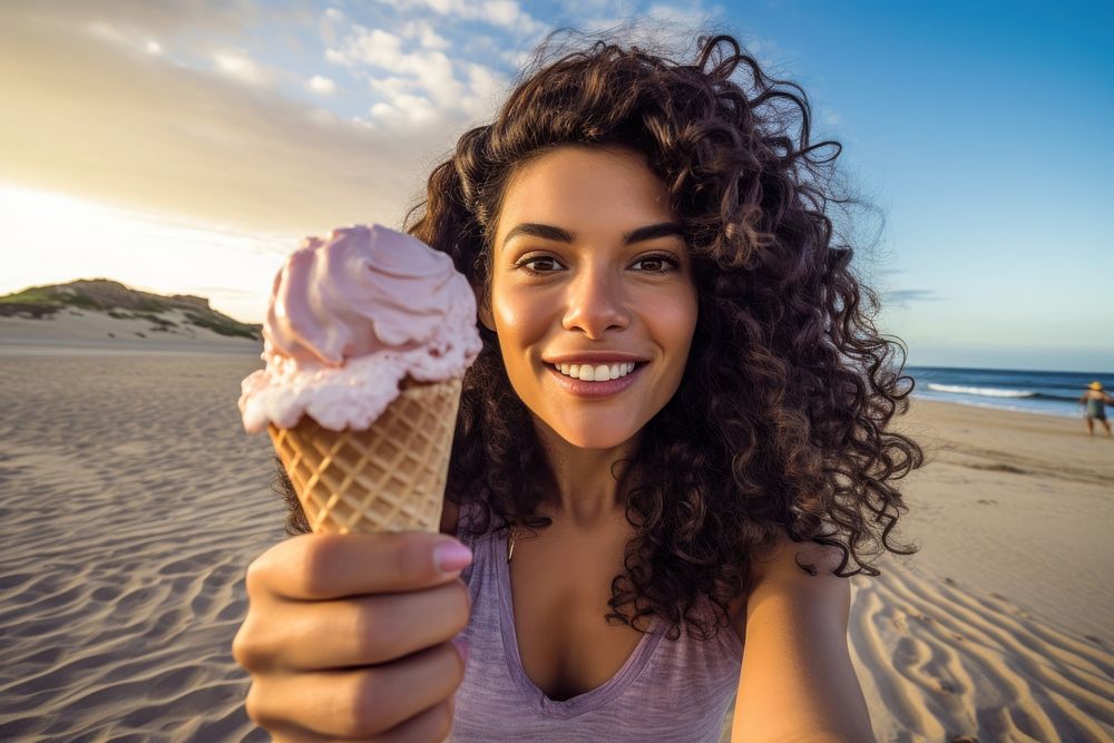 Selfie Latina woman holding an ice cream on a beach portrait vacation dessert. AI generated Image by rawpixel.