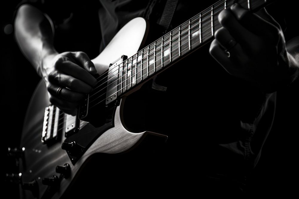 Hand playing guitar monochrome musician black. AI generated Image by rawpixel.