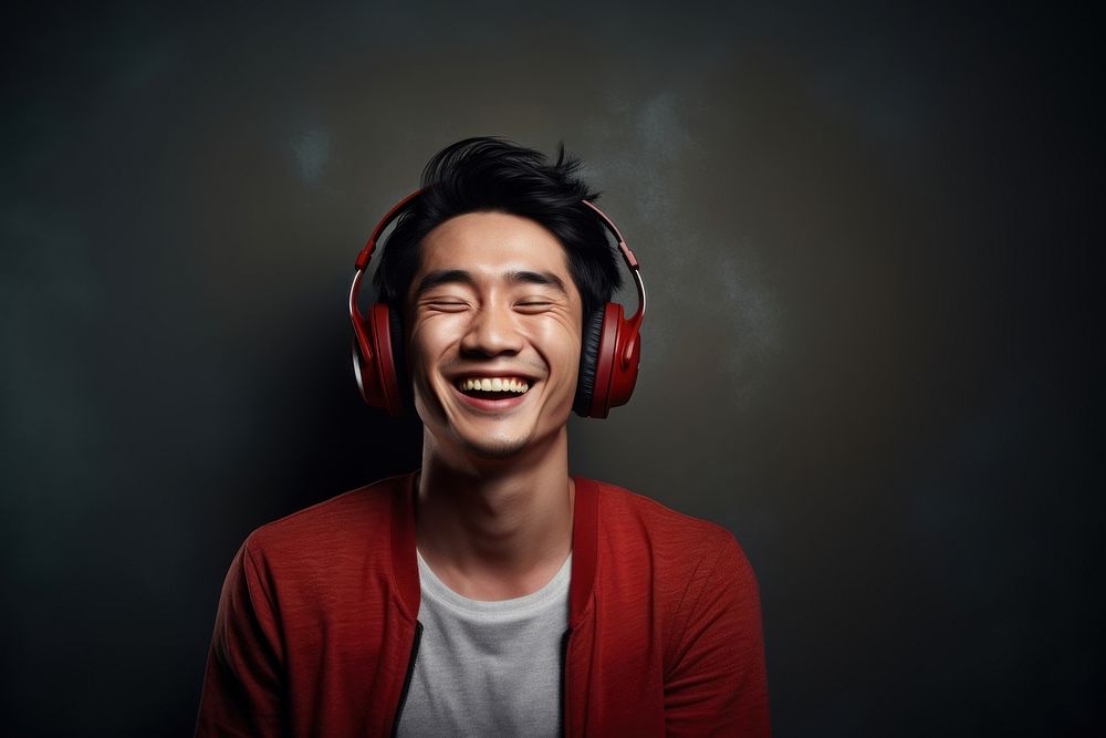 Happy korean man headphones listening laughing. AI generated Image by rawpixel.