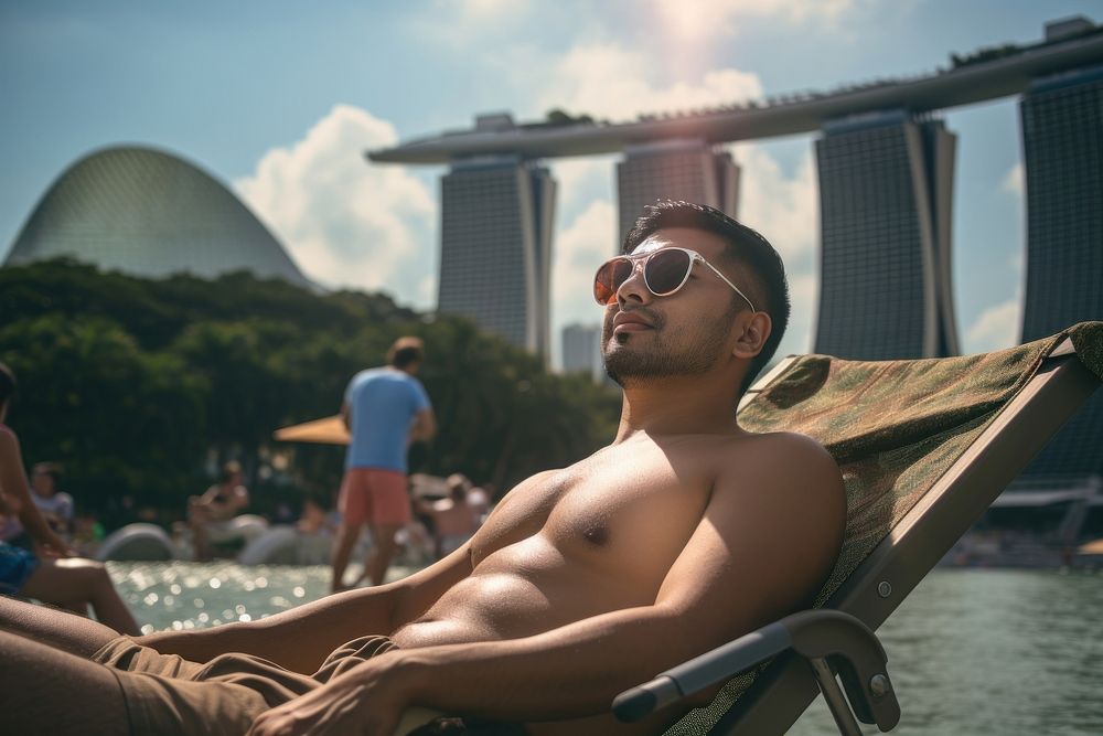 Singaporean men sunbathing sunglasses outdoors. AI generated Image by rawpixel.