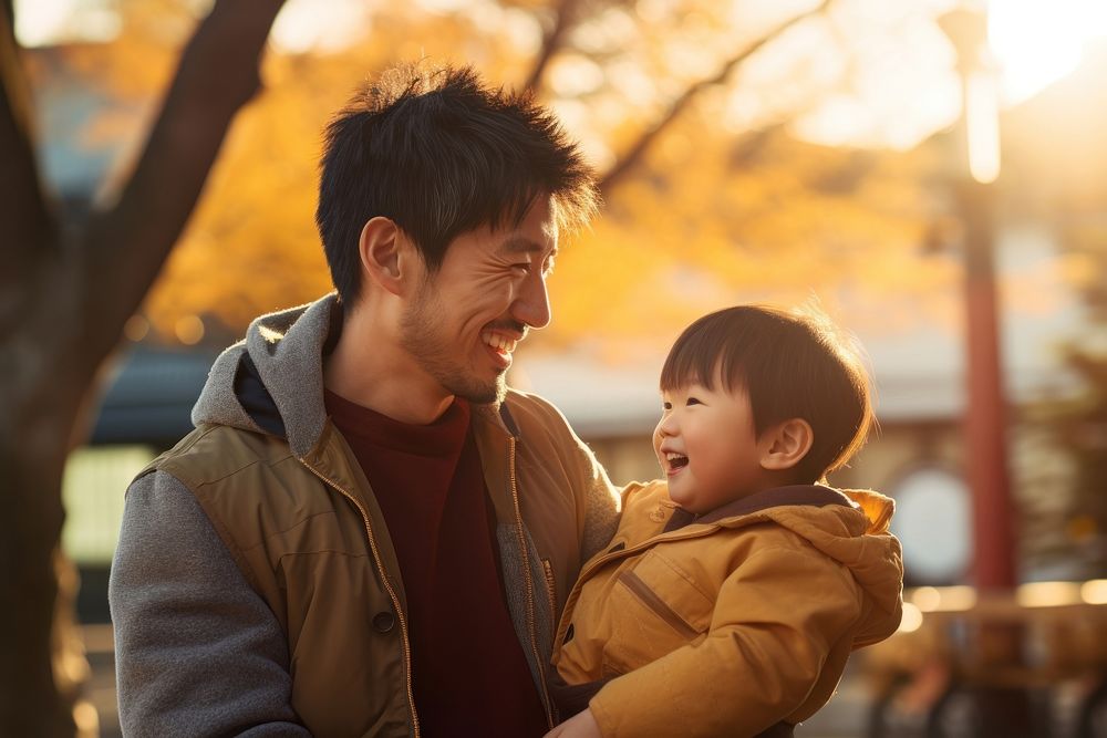 Smiling japanese father carrying his son portrait people photo. AI generated Image by rawpixel.