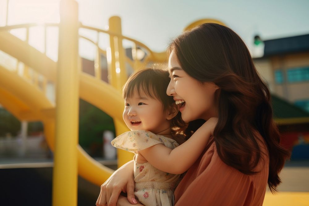 Smiling Japanese mother playground portrait outdoors. AI generated Image by rawpixel.