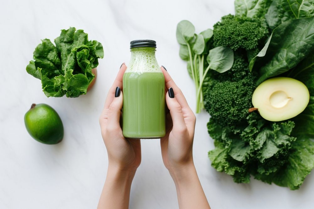 Green veg juice vegetable holding bottle. AI generated Image by rawpixel.