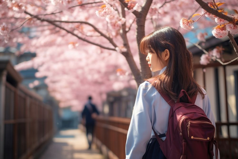 Japanese student wearing uniform blossom backpack walking. AI generated Image by rawpixel.