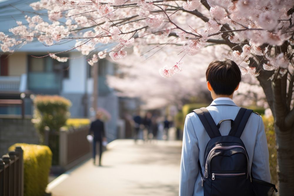 Japanese student wearing uniform blossom walking street. AI generated Image by rawpixel.