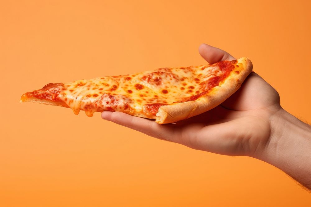 Hand holding a slice of pizza food pepperoni flatbread. AI generated Image by rawpixel.