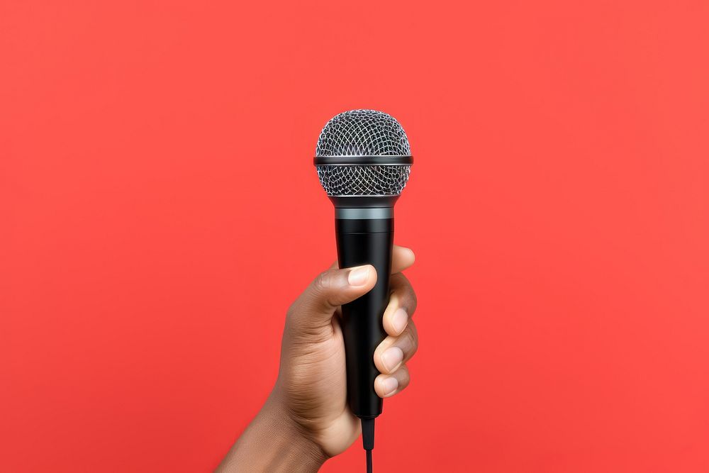 Hand holding microphone performance technology karaoke. AI generated Image by rawpixel.