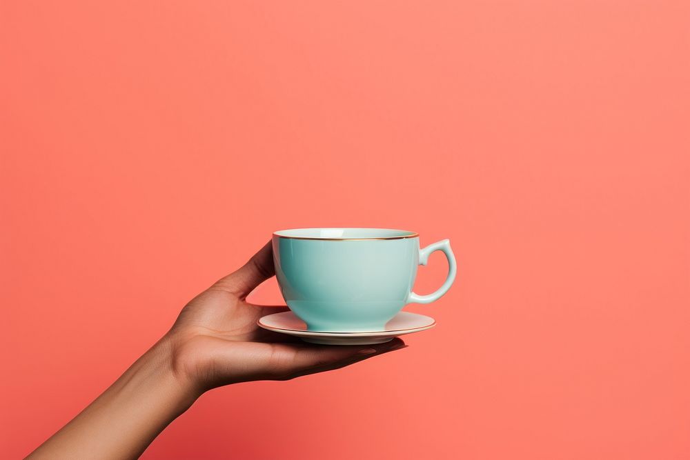 Hand holding tea cup coffee drink mug. AI generated Image by rawpixel.