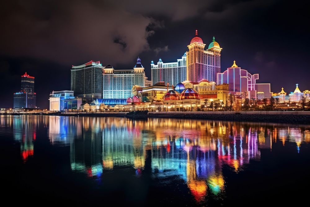 Illuminated skyline glows over crowded waterfront casino night architecture illuminated. AI generated Image by rawpixel.
