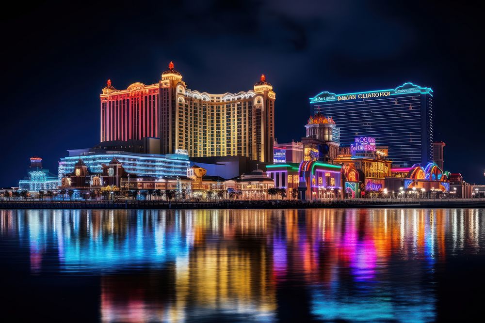 Illuminated skyline glows over crowded waterfront casino architecture illuminated cityscape. AI generated Image by rawpixel.