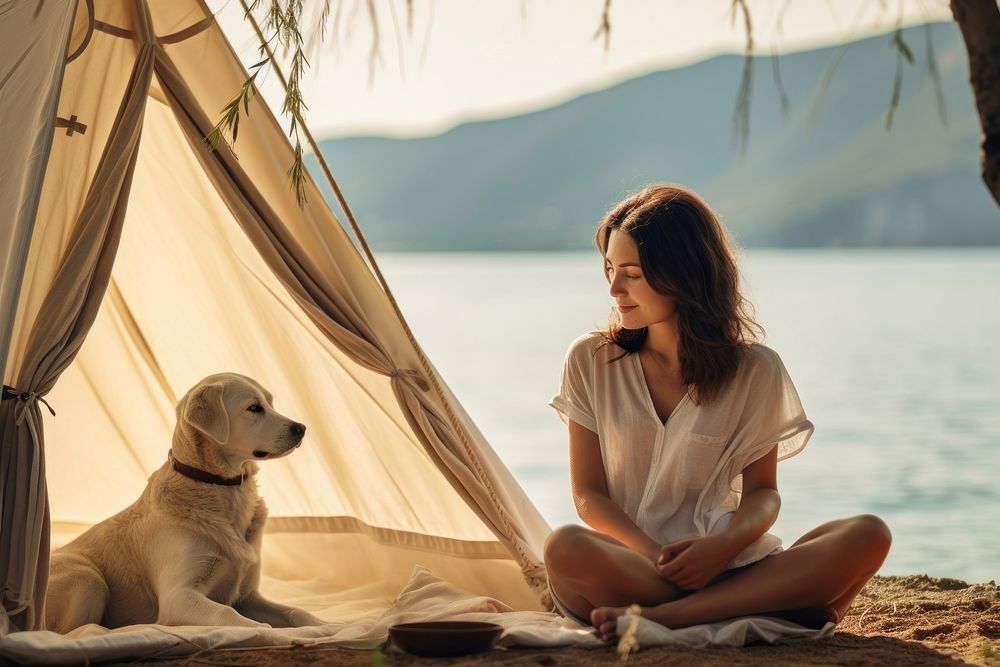 Asian woman with labrador retriever camping outdoors sitting summer. AI generated Image by rawpixel.