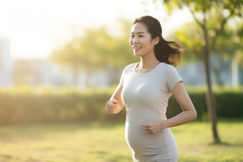 Jogging pregnant outdoors running. AI generated Image by rawpixel.