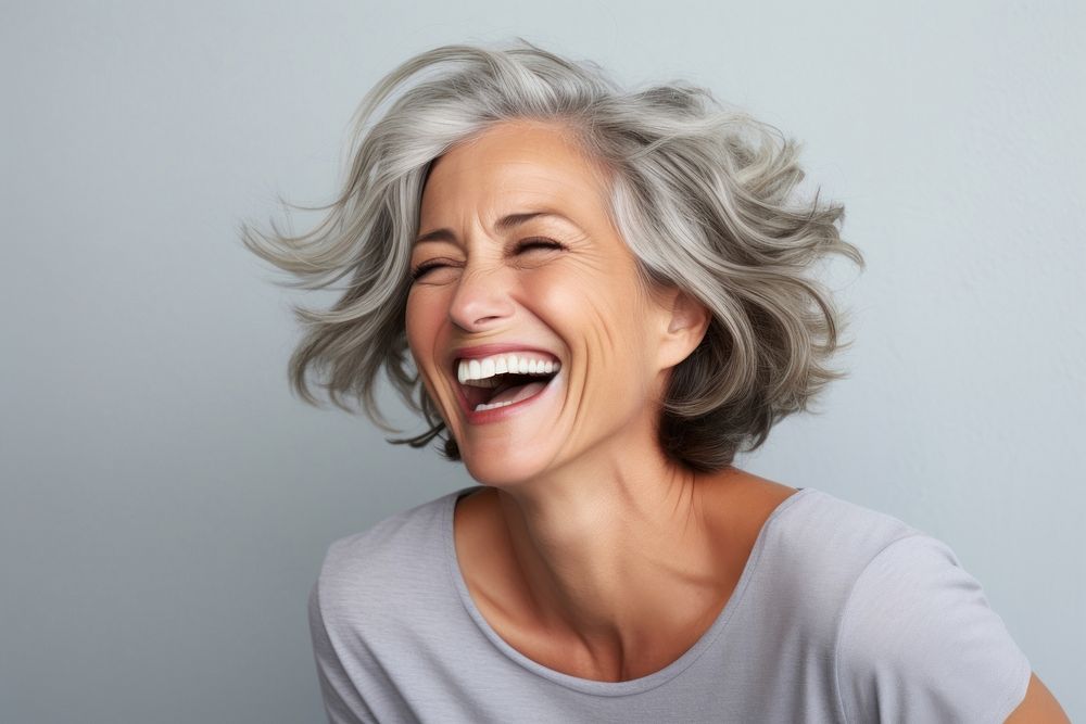 Woman middle age laughing adult happiness. AI generated Image by rawpixel.