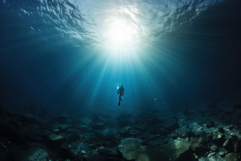 Diver swimming in blue sea underwater adventure outdoors