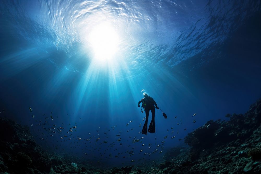 Diver swimming in blue sea underwater adventure outdoors. AI generated Image by rawpixel.