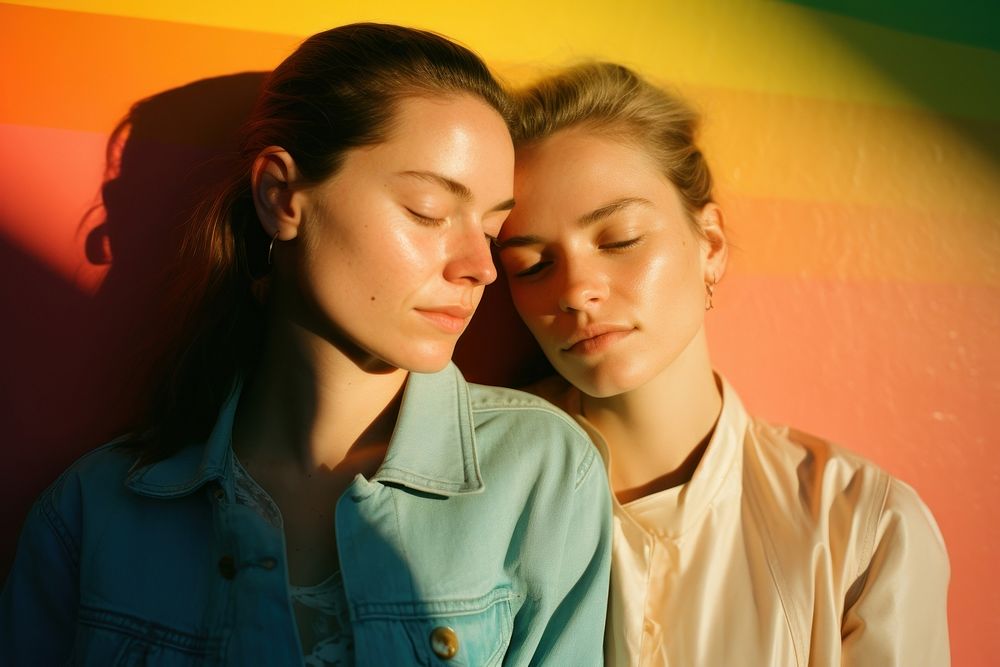 Rainbow light on body of lesbian couple face photography portrait togetherness. AI generated Image by rawpixel.