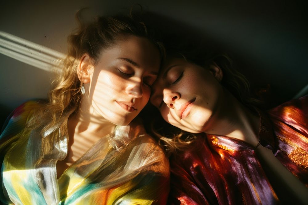 Rainbow light on body of lesbian couple face photography portrait adult. AI generated Image by rawpixel.