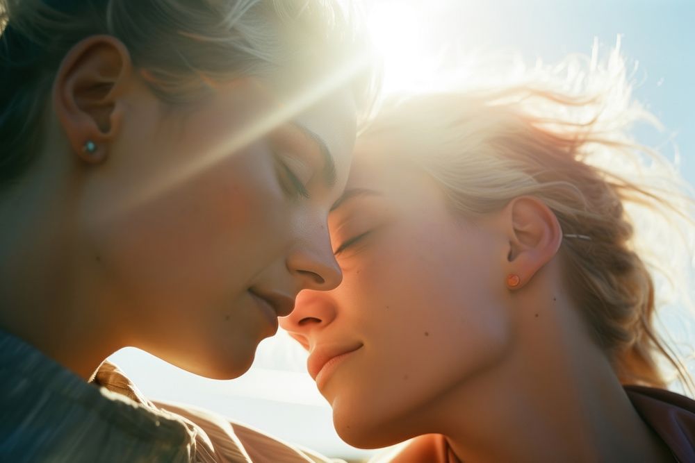 Rainbow light on body of lesbian couple face photography portrait sunlight. AI generated Image by rawpixel.