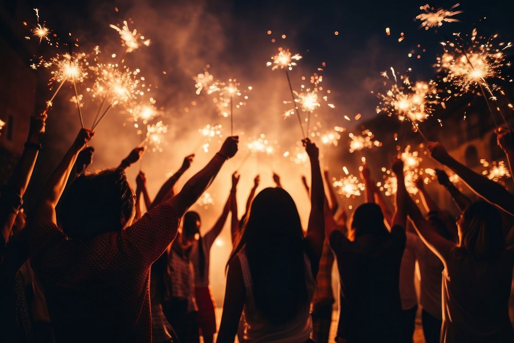 Celebrating New Year sparkler sparks adult. AI generated Image by rawpixel.
