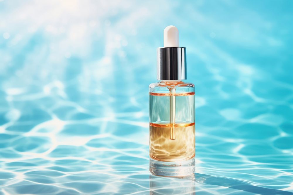 Serum bottle on a bright background cosmetics perfume refreshment. AI generated Image by rawpixel.