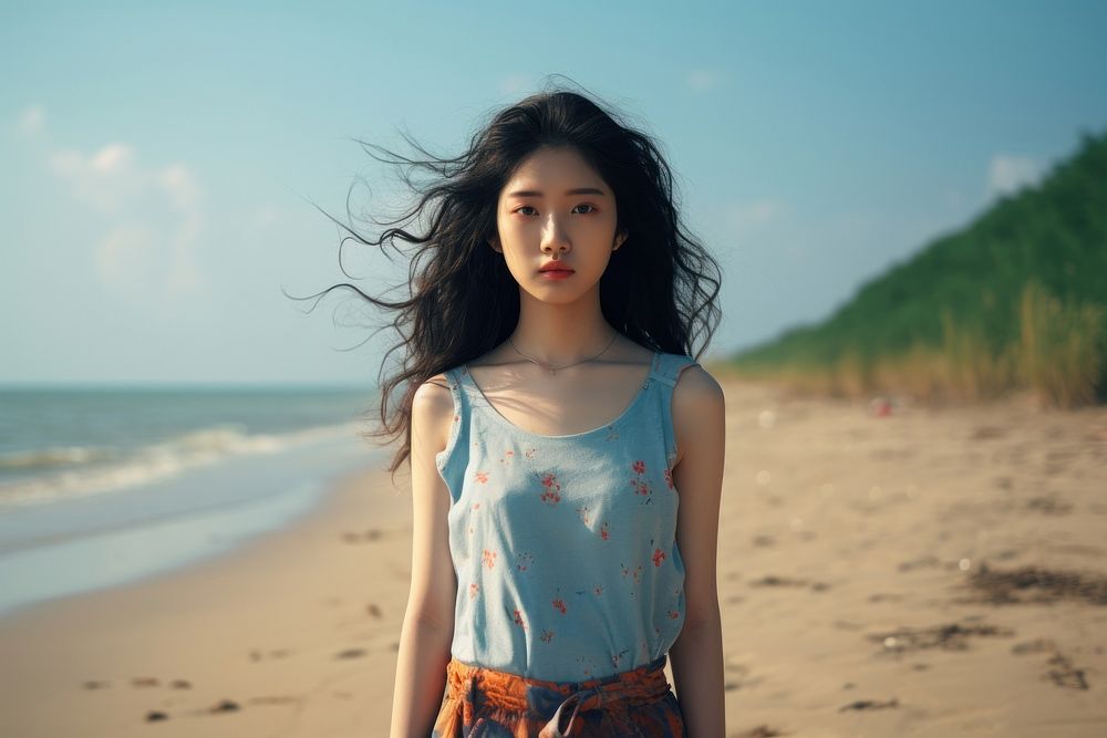 Chinese girl standing near Beach portrait summer beach. AI generated Image by rawpixel.
