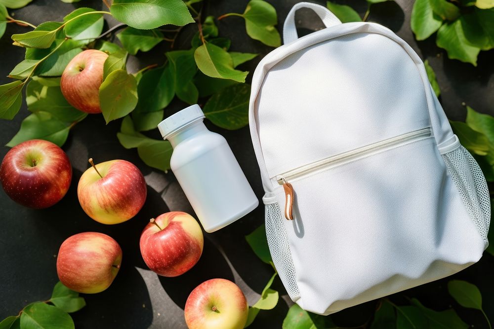 A cute white backpack bottle apple handbag. AI generated Image by rawpixel.
