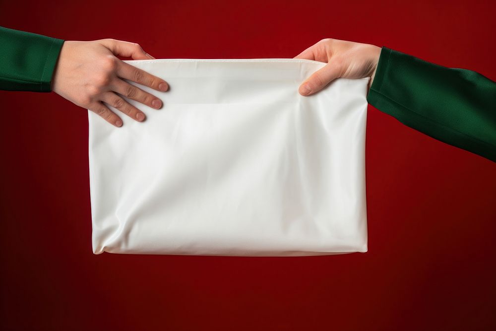 Blank white fabric bag paper hand red. AI generated Image by rawpixel.