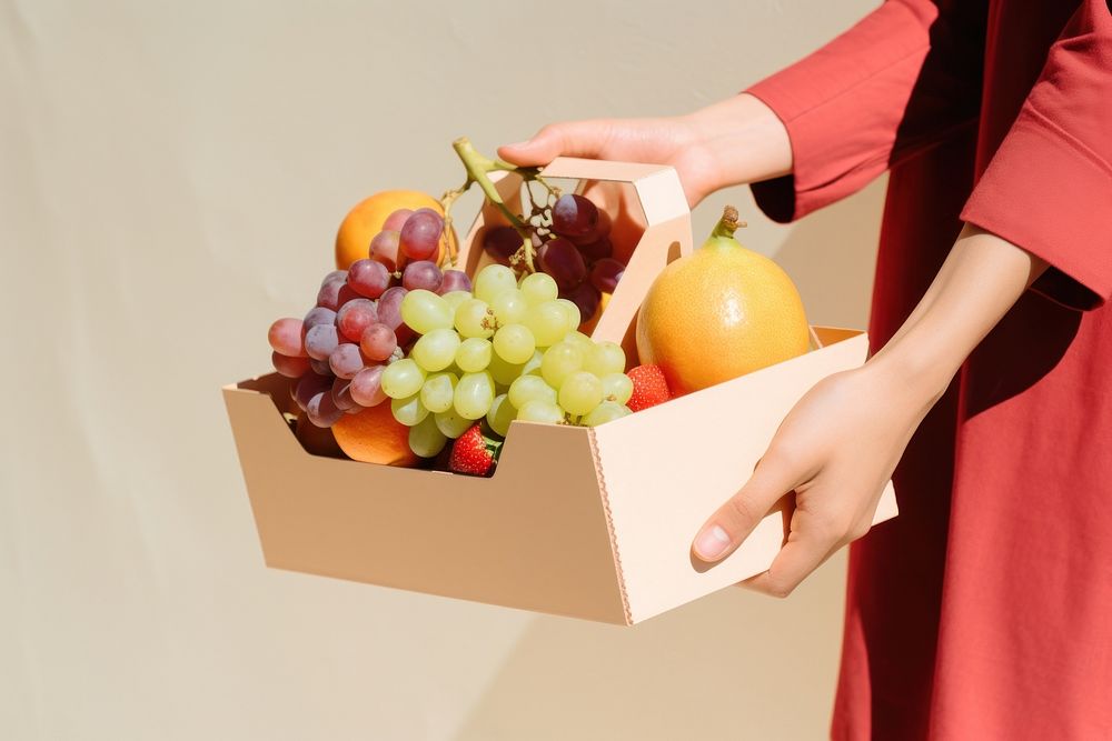 Hand holding fruits box cardboard adult plant. AI generated Image by rawpixel.